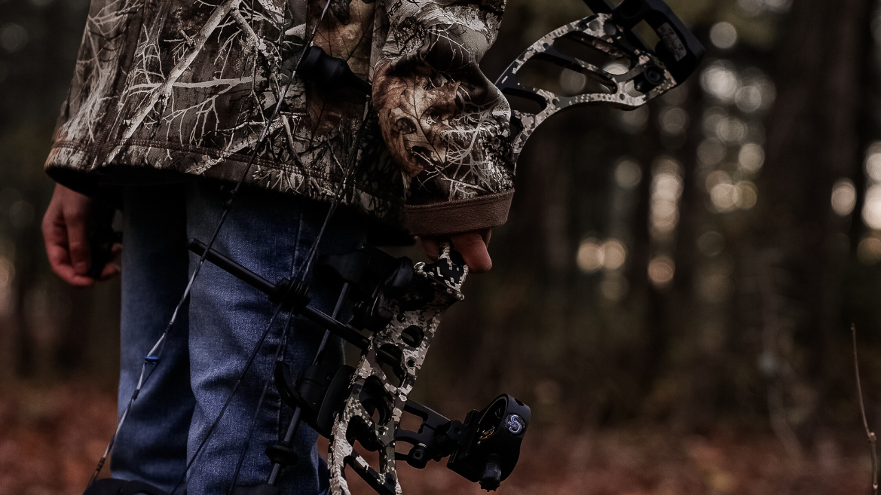 Youth drawing back Prime NXT bow